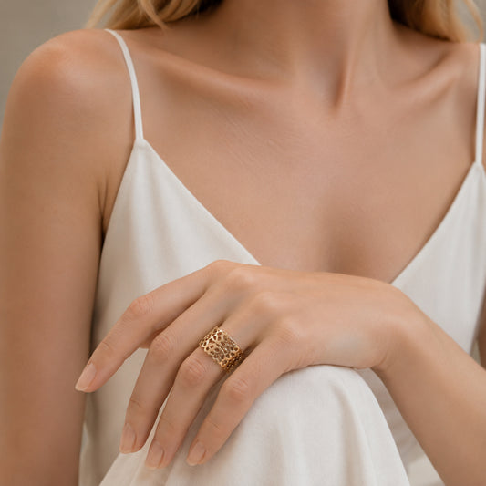 18k gold Medé openwork band ring, with lace-like sculptural details, a contemporary high jewelry design by Carlotta di Montefalco.
