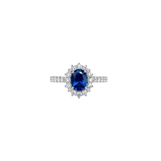 18k white gold ring with oval blue sapphire, diamond halo and pavé band, Carlotta di Montefalco high jewelry
